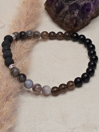 Aromaarmband „Schutz & Erdung“ mit Botswana Achat, Rauchquarz, schwarzem Turmalin und Lavaperle, auf Gummiband mit 925er Silber oder vergoldeten Elementen